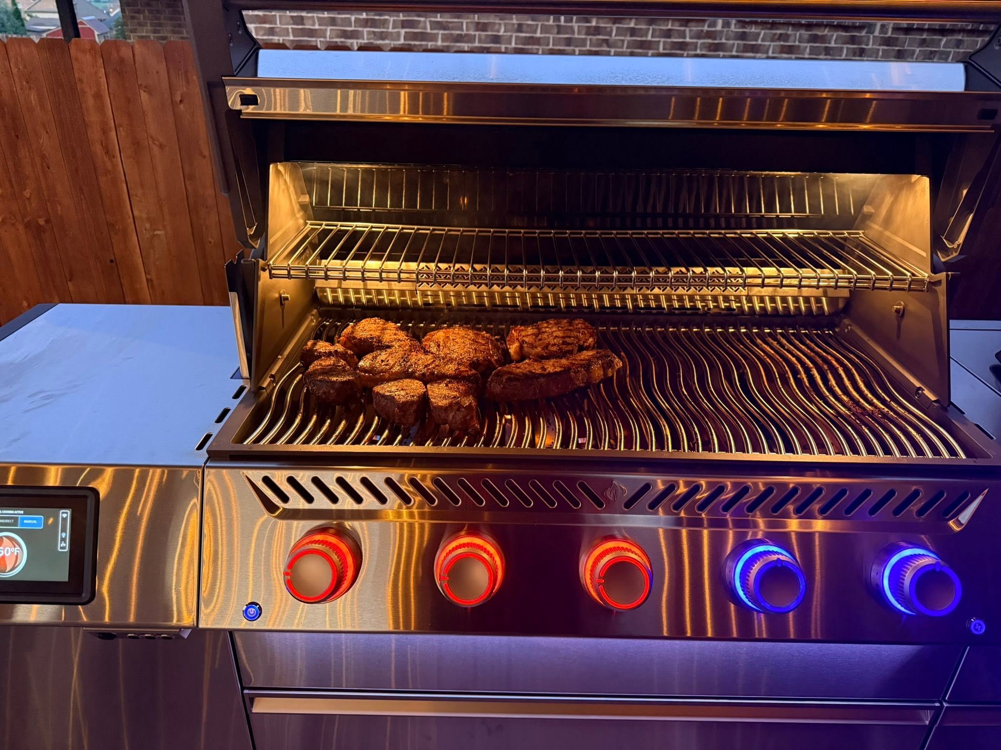 Outdoor kitchen with side burner and refrigeration
