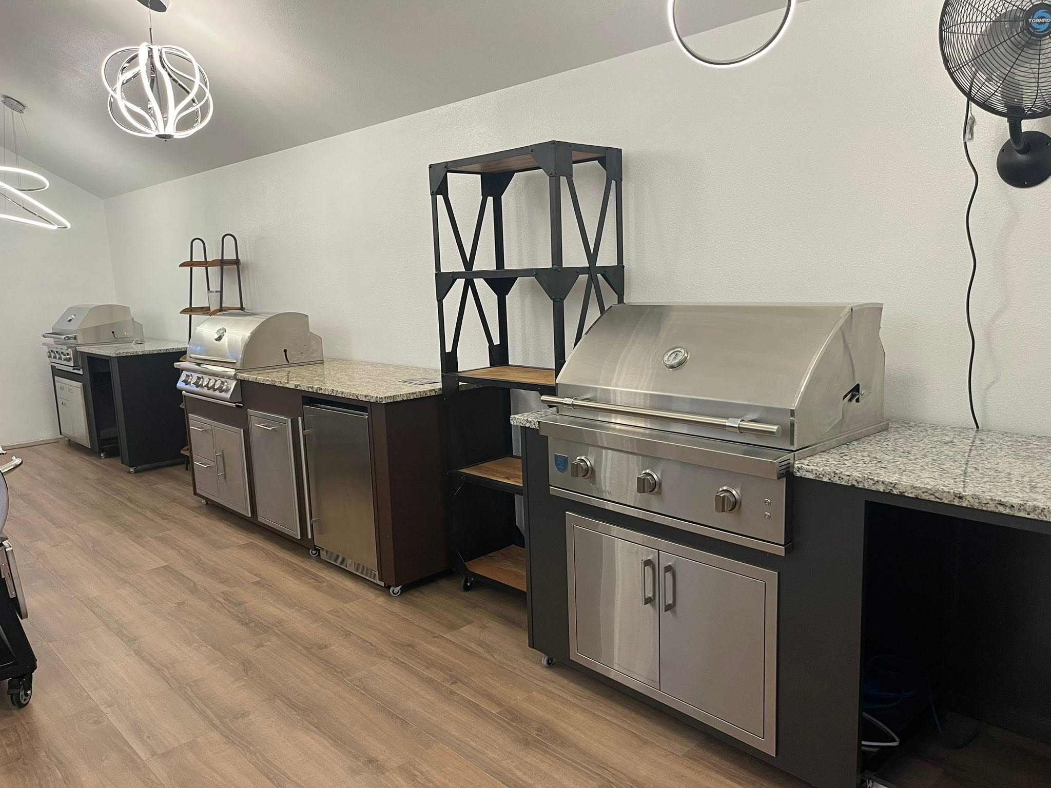 Completed outdoor kitchen with seating and overhead heating